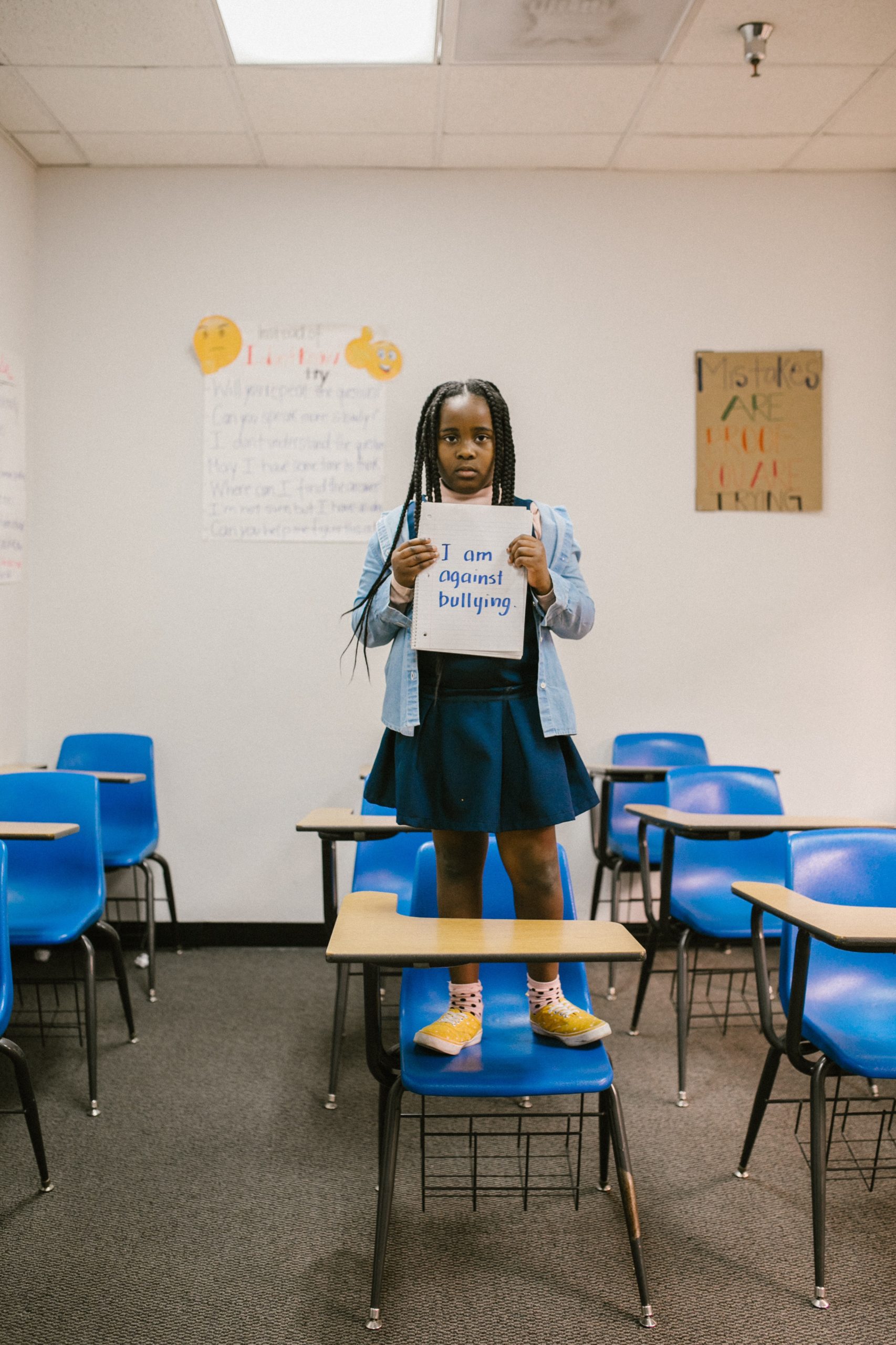 girl standing against bullying